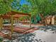 Shady playground with a play structure and benches for parents at 9517 Mountainair Ave, Las Vegas, NV 89134