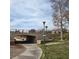 Scenic walking path leading under Spring Gate Lane with well-maintained landscaping at 9517 Mountainair Ave, Las Vegas, NV 89134