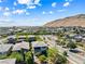 Expansive aerial view of a community with mountain views and well-maintained streets at 7017 Pearl Hilltop Ct, Las Vegas, NV 89148