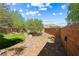 Scenic backyard featuring a charming patio and meticulously designed landscaping at 7017 Pearl Hilltop Ct, Las Vegas, NV 89148