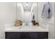 Clean and modern half bathroom with a white countertop and dark cabinetry at 7017 Pearl Hilltop Ct, Las Vegas, NV 89148