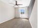 Empty bedroom with neutral walls, a ceiling fan, carpet and a window at 7017 Pearl Hilltop Ct, Las Vegas, NV 89148
