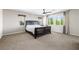 Spacious main bedroom featuring a king-size bed, mountain views, ceiling fan, and plush carpet at 7017 Pearl Hilltop Ct, Las Vegas, NV 89148