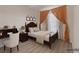 Bedroom featuring neutral decor, wood flooring, bedside table, and window at 10001 Peace Way # 2322, Las Vegas, NV 89147