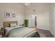 Bright bedroom featuring neutral decor, hardwood floors, and ensuite bathroom access at 10001 Peace Way # 2322, Las Vegas, NV 89147