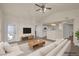 Bright living room featuring vaulted ceiling, contemporary furnishings, and hardwood floors at 10001 Peace Way # 2322, Las Vegas, NV 89147