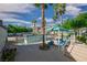 A large community pool with cabanas under towering palm trees promises a relaxing escape in a tropical setting at 10001 Peace Way # 2322, Las Vegas, NV 89147