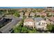 Aerial shot of a two-story home with a balcony in a neighborhood with tree lined streets at 1013 Brinkman St, Las Vegas, NV 89138