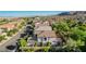 An aerial view showcases a stucco home with tile roof in a neighborhood setting, emphasizing privacy and curb appeal at 1013 Brinkman St, Las Vegas, NV 89138