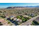 Aerial view of a neighborhood with uniform landscaping, sidewalks and trees. Mountains in the background at 1013 Brinkman St, Las Vegas, NV 89138