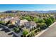 An aerial view of a stucco two-story home with a tile roof, set in a neighborhood with mountain views at 1013 Brinkman St, Las Vegas, NV 89138