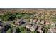 Lush neighborhood with tree-lined streets, a park, and diverse home styles in an appealing aerial perspective at 1013 Brinkman St, Las Vegas, NV 89138
