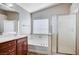 Bright bathroom featuring soaking tub and separate shower with glass door at 1013 Brinkman St, Las Vegas, NV 89138