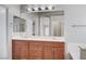 Bathroom featuring double sinks, large mirror and soaking tub with a tiled floor at 1013 Brinkman St, Las Vegas, NV 89138