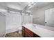 Bathroom featuring large framed mirror, white tiled shower over tub and a light countertop at 1013 Brinkman St, Las Vegas, NV 89138