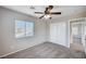 Bedroom with carpeted flooring, neutral walls, window with blinds and a ceiling fan at 1013 Brinkman St, Las Vegas, NV 89138