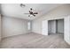 Bright bedroom features neutral colored walls, vaulted ceilings, plush carpet, and a window with blinds at 1013 Brinkman St, Las Vegas, NV 89138