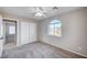 Bedroom with sliding door closet and large arched window for lots of light at 1013 Brinkman St, Las Vegas, NV 89138