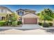 Charming two-story home featuring a two-car garage and manicured landscaping at 1013 Brinkman St, Las Vegas, NV 89138