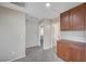 Hallway features carpeted flooring, neutral walls and dark wood cabinets at 1013 Brinkman St, Las Vegas, NV 89138