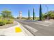 Neat intersection featuring well-marked pedestrian crosswalks with green trees in the background at 1013 Brinkman St, Las Vegas, NV 89138