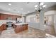 Open kitchen with stainless appliances and an island, next to the living room at 1013 Brinkman St, Las Vegas, NV 89138