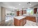 Bright kitchen with island, stainless appliances, and sliding doors to the backyard at 1013 Brinkman St, Las Vegas, NV 89138
