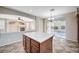 Kitchen island and view of backyard with fireplace in the living room at 1013 Brinkman St, Las Vegas, NV 89138