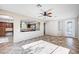 Spacious living room with tiled floors, a view into the kitchen, and a doorway leading to the outside at 1013 Brinkman St, Las Vegas, NV 89138