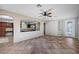 Open living space features tile floors, a fireplace and seamless flow into the kitchen at 1013 Brinkman St, Las Vegas, NV 89138
