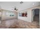 Open living room boasts tile floors, a fireplace and large windows offering natural light at 1013 Brinkman St, Las Vegas, NV 89138