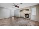 Cozy living room showcases a fireplace, tile flooring, and a door for outdoor access at 1013 Brinkman St, Las Vegas, NV 89138