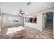 Bright and airy living room featuring tiled floors, a fireplace, and an open layout connected to the kitchen at 1013 Brinkman St, Las Vegas, NV 89138
