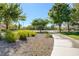 Well-kept gravel area, trees, sidewalk, and lawns create a beautiful street at 1013 Brinkman St, Las Vegas, NV 89138