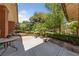 A backyard patio with lush greenery and garden views, a tranquil outdoor space at 112 Quail Run Rd, Henderson, NV 89014