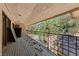 Balcony with views of the yard, pool, trees and sky at 112 Quail Run Rd, Henderson, NV 89014