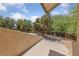 Upper-level balcony overlooking the landscaped yard and trees at 112 Quail Run Rd, Henderson, NV 89014