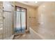 Bathroom with a bathtub and shower featuring white tiling at 112 Quail Run Rd, Henderson, NV 89014