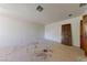 Bedroom featuring unfinished flooring, natural light, and ample space for renovation at 112 Quail Run Rd, Henderson, NV 89014