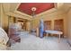 Dining area with a red ceiling, chandelier, and covered furnishings at 112 Quail Run Rd, Henderson, NV 89014