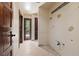 Hallway leading to an adjacent bathroom with open plumbing at 112 Quail Run Rd, Henderson, NV 89014