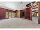 Large living room with exposed wall studs and natural lighting from the large windows at 112 Quail Run Rd, Henderson, NV 89014