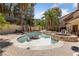 Backyard pool area with a stone-trimmed pool and outdoor exercise equipment at 112 Quail Run Rd, Henderson, NV 89014