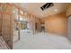 Partially renovated room featuring a view into another room and backyard at 112 Quail Run Rd, Henderson, NV 89014