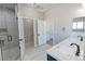 Modern bathroom featuring a double vanity with quartz countertop and a glass-enclosed shower at 1131 Lupin St, Pahrump, NV 89048