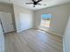 Bedroom with wood-look floors, a window view, and a closet with doors at 1131 Lupin St, Pahrump, NV 89048