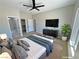 Bright bedroom features a ceiling fan, large windows, and ample space for relaxation at 1131 Lupin St, Pahrump, NV 89048