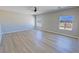 Large bedroom features wood flooring and multiple windows offering lots of natural light at 1131 Lupin St, Pahrump, NV 89048
