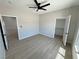 This bedroom offers wood-look floors and two closets for storage, plus a ceiling fan at 1131 Lupin St, Pahrump, NV 89048