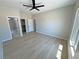 Bright main bedroom with light walls and flooring, with multiple entrances at 1131 Lupin St, Pahrump, NV 89048